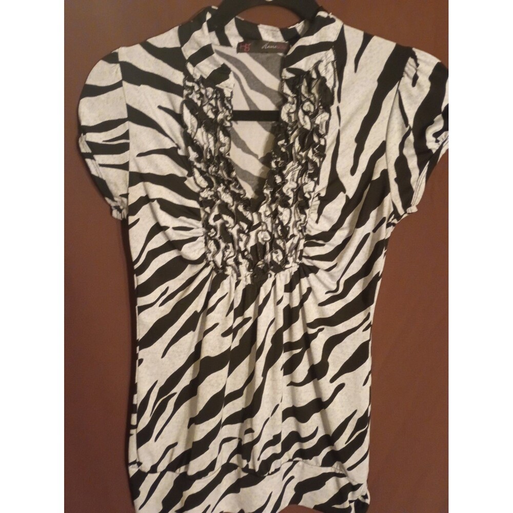 Y2K HeartSoul black and white zebra-print ruffled blouse.